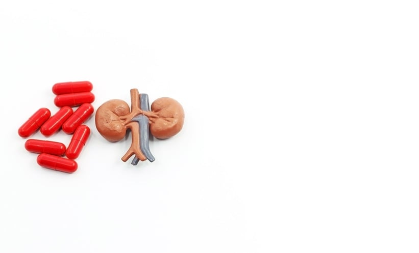 Clinician reviewing uncomplicated UTI care pathway and antimicrobial resistance risks