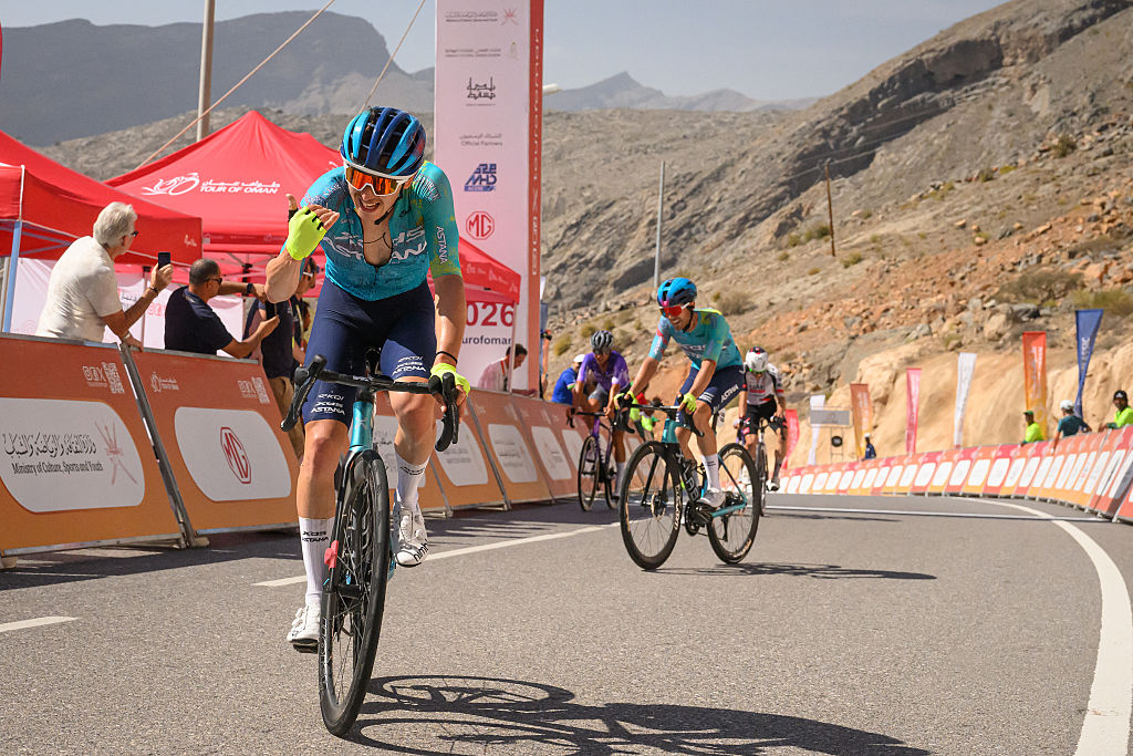 XDS Astana Team's Italian rider Christian Scaroni celebrates while crossing the finish line to win the 5th and last stage, and be winner overall of the Tour of Oman cycling race from Nizwa to Green Mountain, on February 11, 2026. (Photo by Loic VENANCE / AFP)