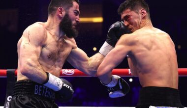 Artur Beterbiev lands a left hand on Dmitry Bivol during their light heavyweight rematch at the ANB Arena in Riyadh, Saudi Arabia, on February 22, 2025.