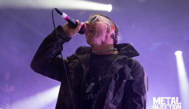 Greg Puciato, vocalist of Better Lovers, performing live on stage with intense energy and dynamic lighting