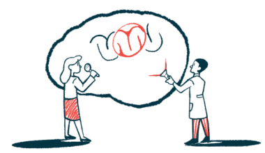 Two researchers stand beside an enlarged image of a brain.