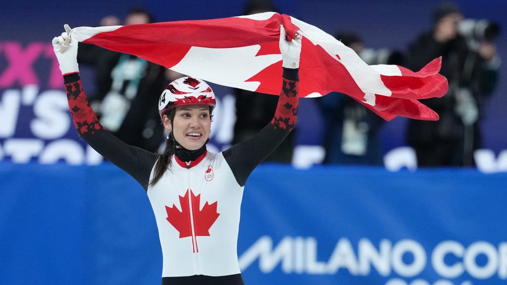 Canada's Courtney Sarault celebrates winning the silver medal in the women's 1,000 metre short track speedskating finals at the 2026 Winter Olympics, in Milan, on Monday, February 16, 2026. THE CANADIAN PRESS/Darryl Dyck