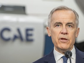 Prime Minister Mark Carney makes an announcement at CAE Inc.