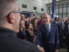 Prime Minister Mark Carney greets CAE Inc. employees.