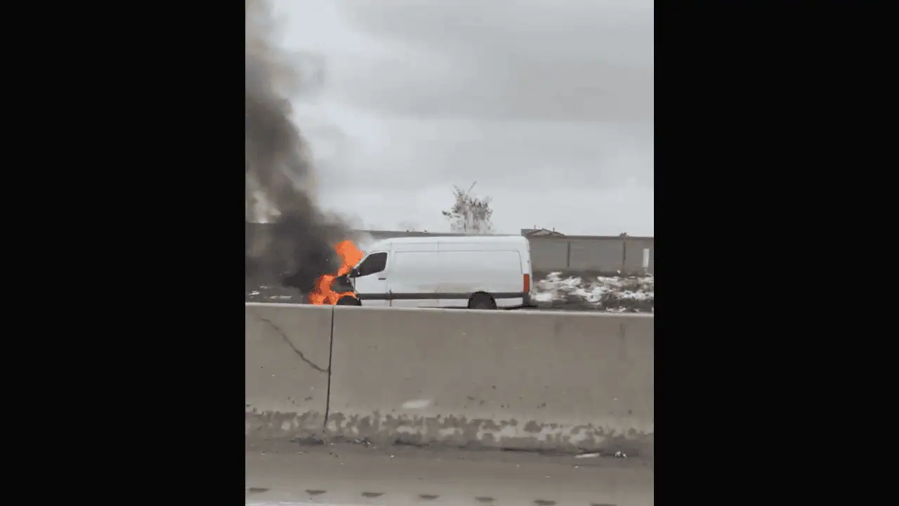 PHOTOS: Van caught on fire on Highway 403 in Mississauga