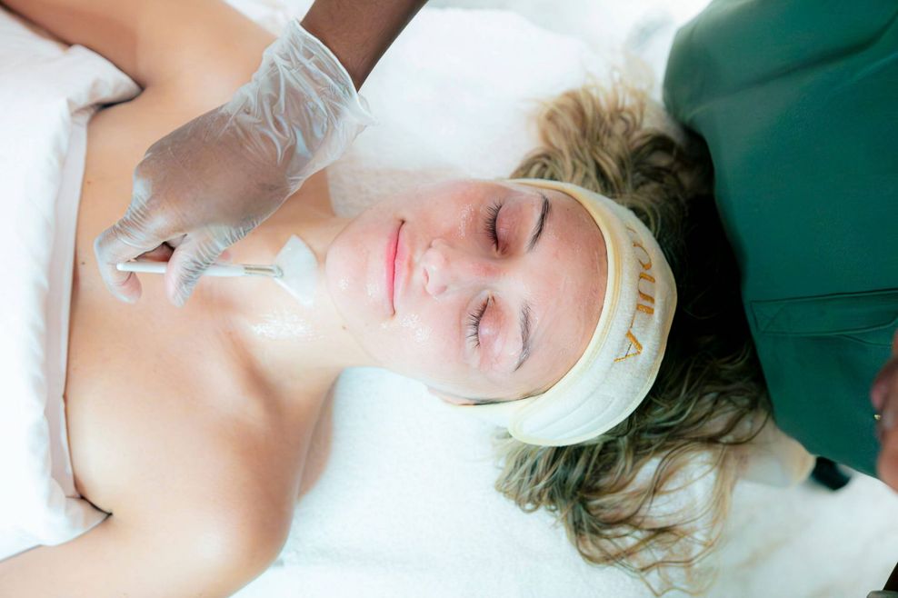 A woman gets a facial at TOULA.