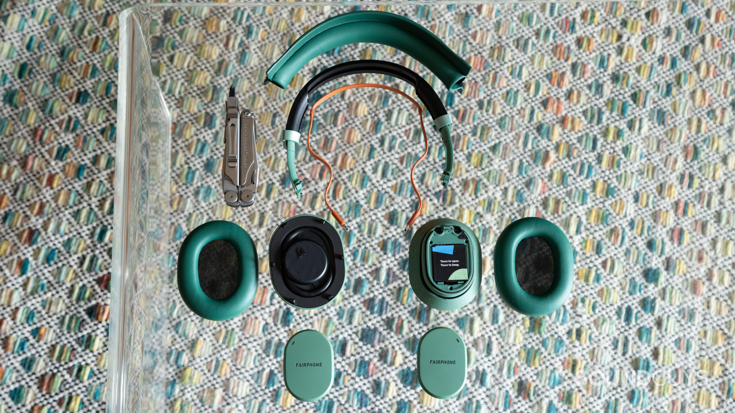 An aerial view of the Fairphone Fairbuds XL disassembled.