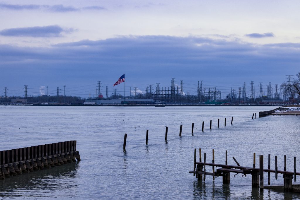 In the foreground, Lake Michigan. On the far shore, there is a data centre with an American flag flying.