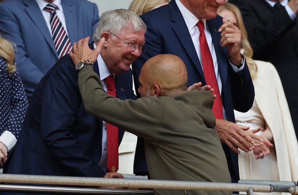 Former Manchester United manager Sir Alex Ferguson shakes hands with Manchester City manager Pep Guardiola after the FA Cup final match between Manchester City and Manchester United at Wembley in London in 2023.