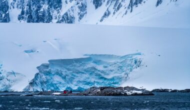 Port Lockroy is a bay with a natural harbour on the north-western shore of Wiencke Island in the Palmer Archipelago, Antartica. The base with the same name, on Goudier Island is the most southerly post office in the world.