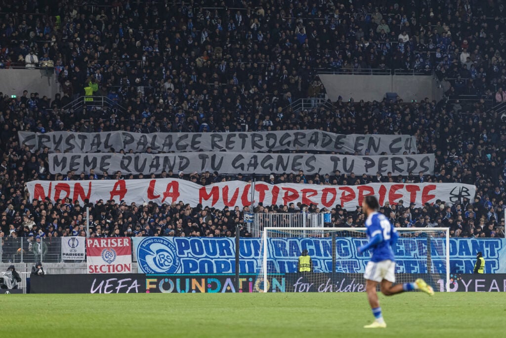 Supporters of Racing Club de Strasbourg display a banner