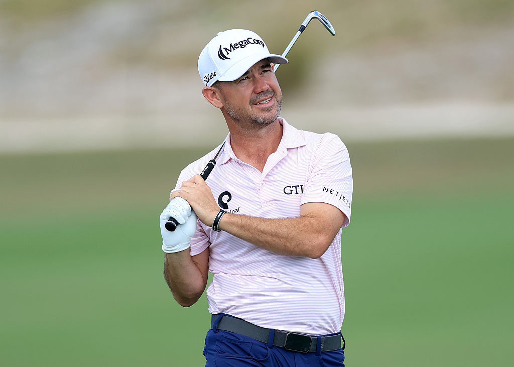 NASSAU, BAHAMAS - DECEMBER 04: Brian Harman of The United States plays his second shot on the first hole during the first round of the Hero World Challenge 2025 at Albany Golf Course on December 04, 2025 in Nassau, Bahamas. (Photo by David Cannon/Getty Images)