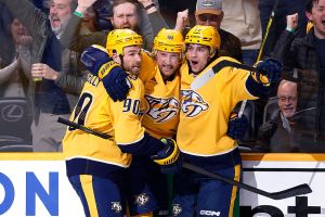 NASHVILLE, TENNESSEE - FEBRUARY 02: Luke Evangelista #77, Ryan O'Reilly #90 and Steven Stamkos #91 of the Nashville Predators celebrate after a goal in the third period at Bridgestone Arena on February 02, 2026 in Nashville, Tennessee. (Photo by Johnnie Izquierdo/Getty Images)