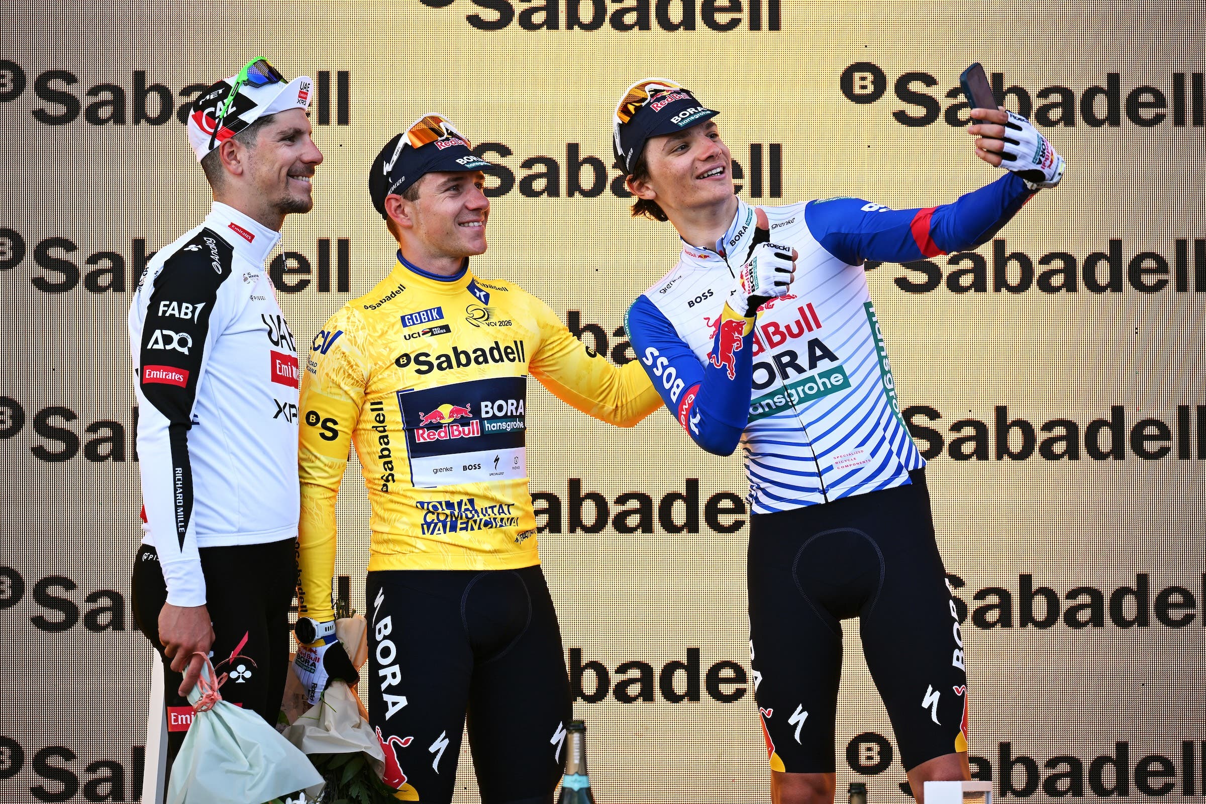Remco Evenepoel (Red Bull-Bora-Hansgrohe) on the podium as winner of the Volta Communitat Valenciana, together with runner-up Joao Almeida (UAE Emirates-XRG) and his own teammate Giulio Pellizzari (Photo: Szymon Gruchalski/Getty Images)
