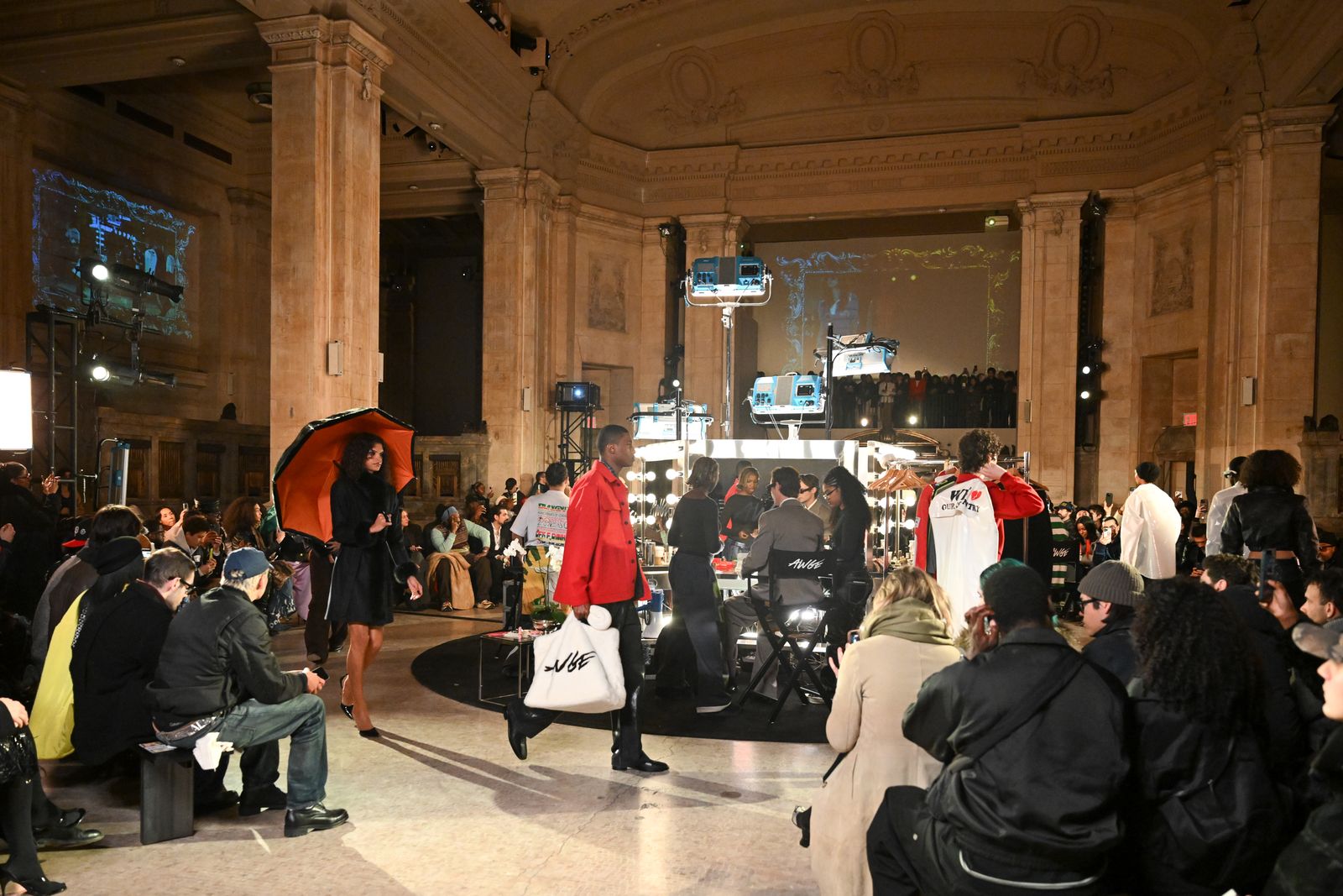 Image may contain Walter Jones People Person Urban Adult Concert Crowd Clothing Coat Indoors and Lighting