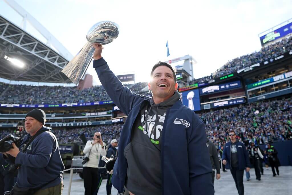 Coach Mike McDonald of the Seattle Seahawks celebrates with fans during the team's Super Bowl party.