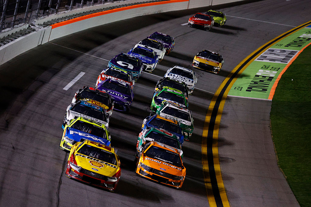 DAYTONA BEACH, FLORIDA - FEBRUARY 12: Joey Logano, driver of the #22 Shell Pennzoil Ford, and Chris Buescher, driver of the #17 Body Guard Ford, lead the field during Duel 1 for the NASCAR Cup Series Daytona 500 at Daytona at Daytona International Speedway on February 12, 2026 in Daytona Beach, Florida. (Photo by Sean Gardner/Getty Images)