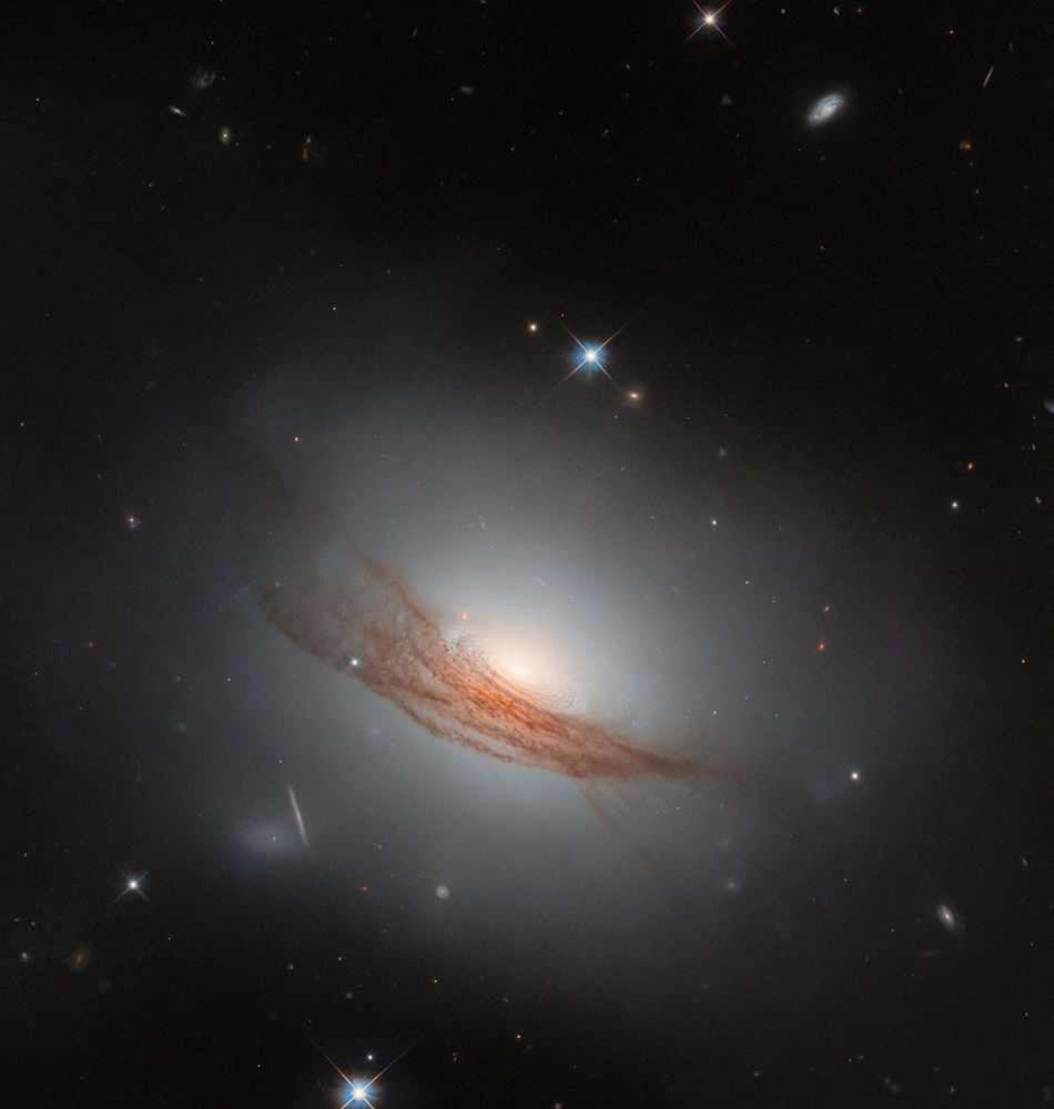 NGC 7722 is a lenticular galaxy about 185 million light-years away. The Hubble captured this image when following up on a supernova that was detected here in 2022. The supernova isn't visible in the image, but this dramatic portrait doesn't need an exploding stellar diva to capture out attention. Image Credit: ESA/Hubble &amp; NASA, R. J. Foley (UC Santa Cruz), Dark Energy Survey/DOE/FNAL/DECam/CTIO/NOIRLab/NSF/AURA; Acknowledgment: Mehmet Yüksek