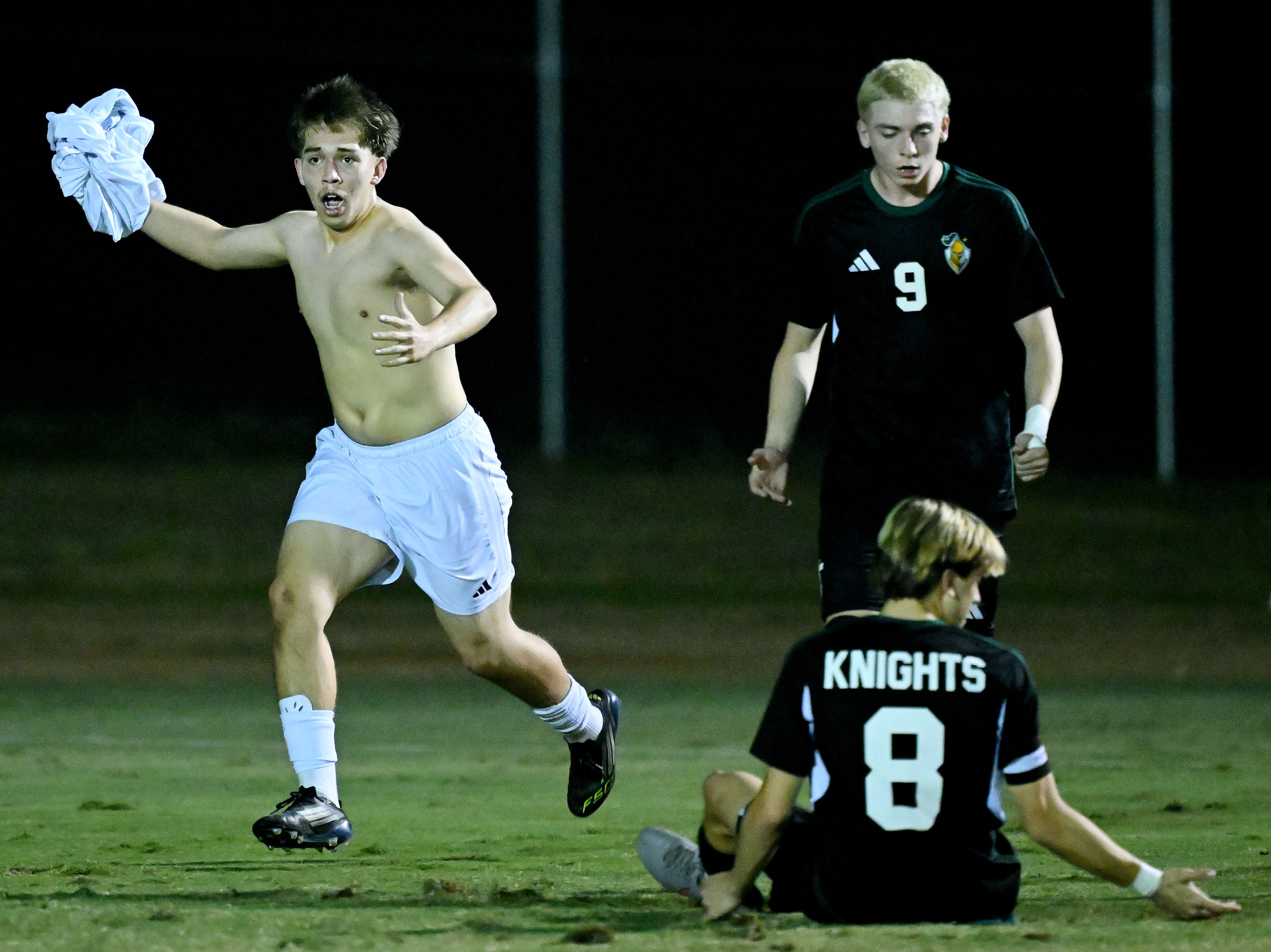 Animo Leadership forward Jeremiah Medrano (13), left, rips off his...