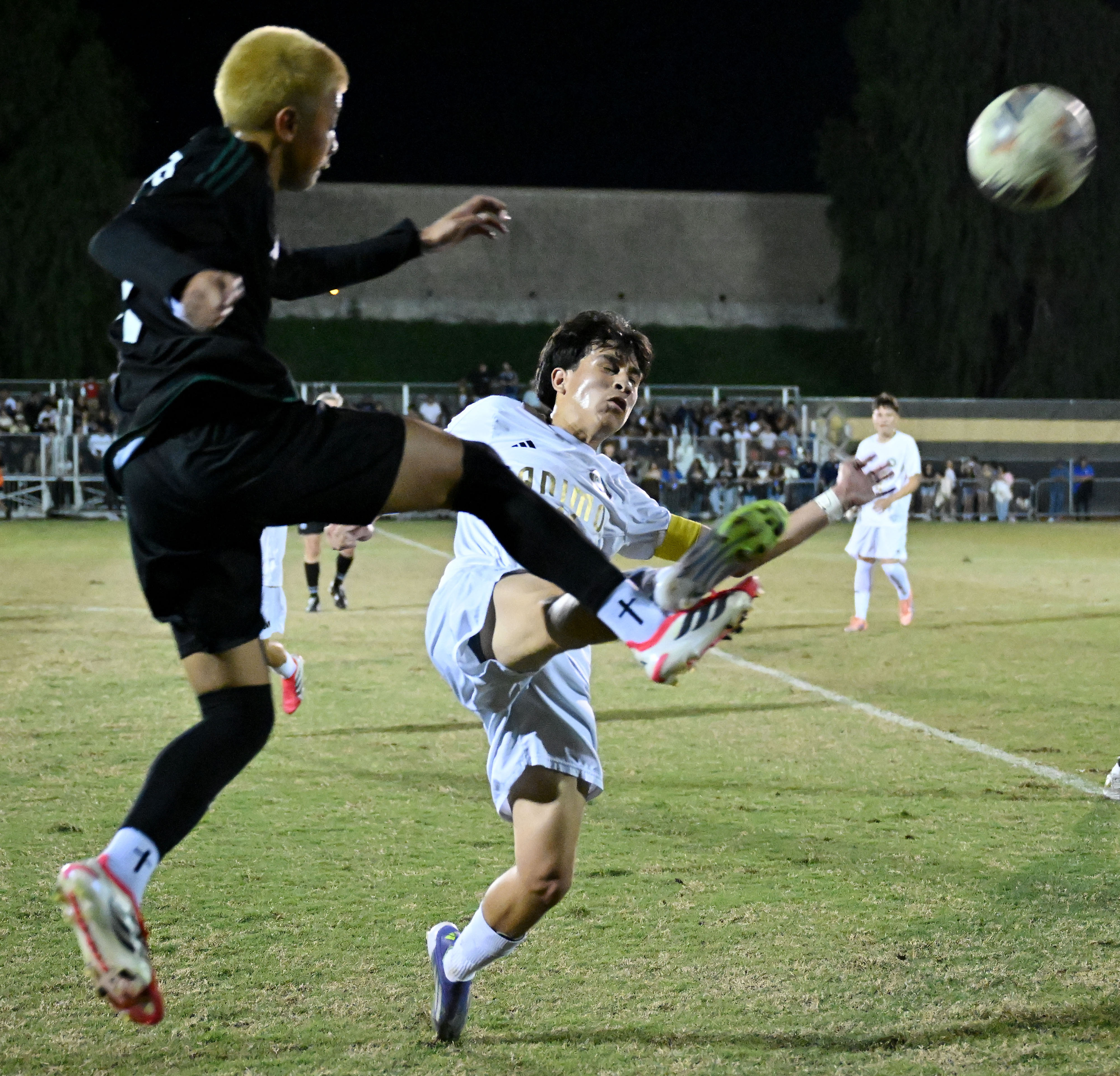 Ontario Christian defender Trajen Fajardo (17) kicks the ball past...