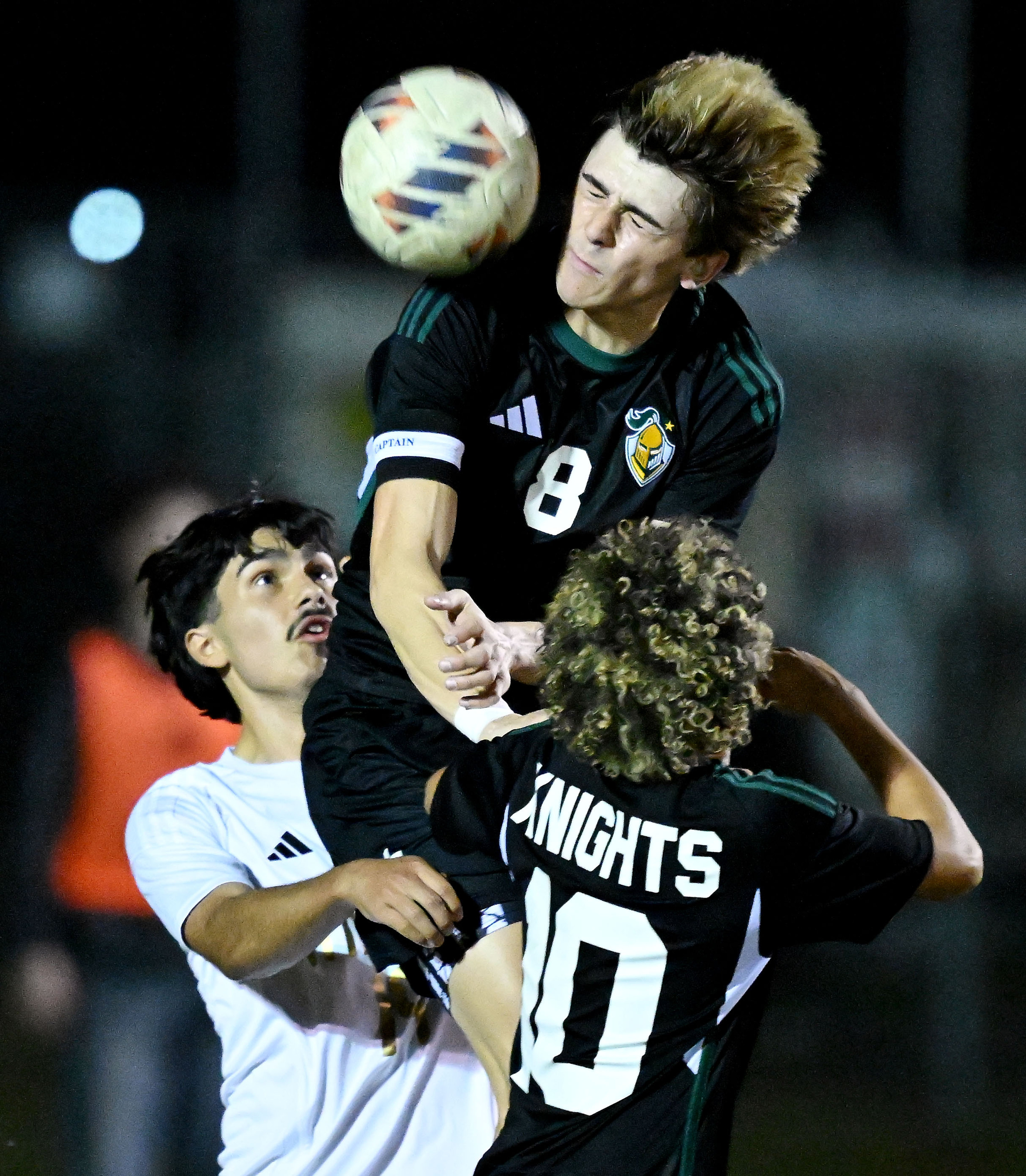 Ontario Christian defender Jacob de Corte (8) takes the header...