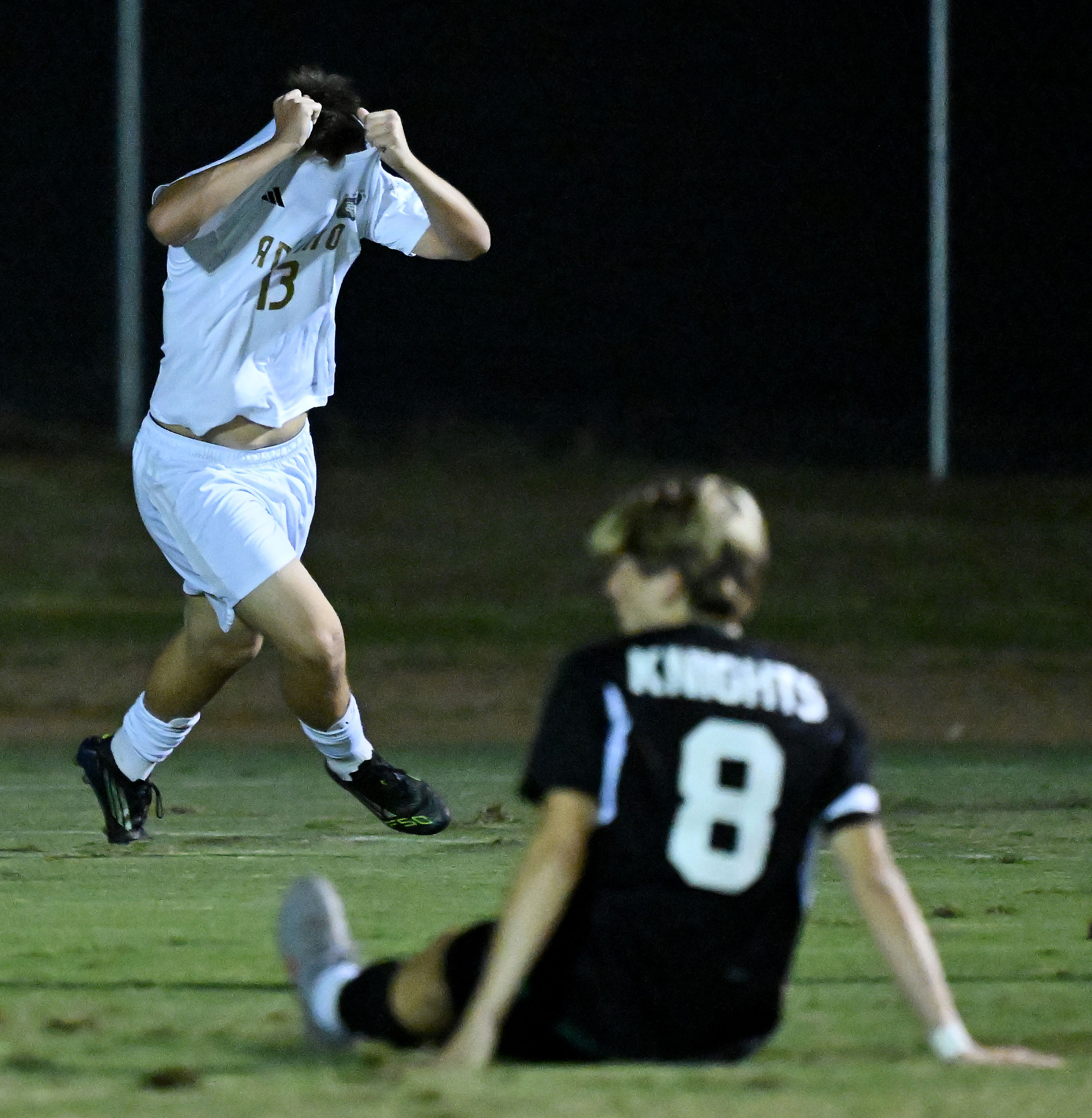 Animo Leadership forward Jeremiah Medrano (13) rips off his jersey...