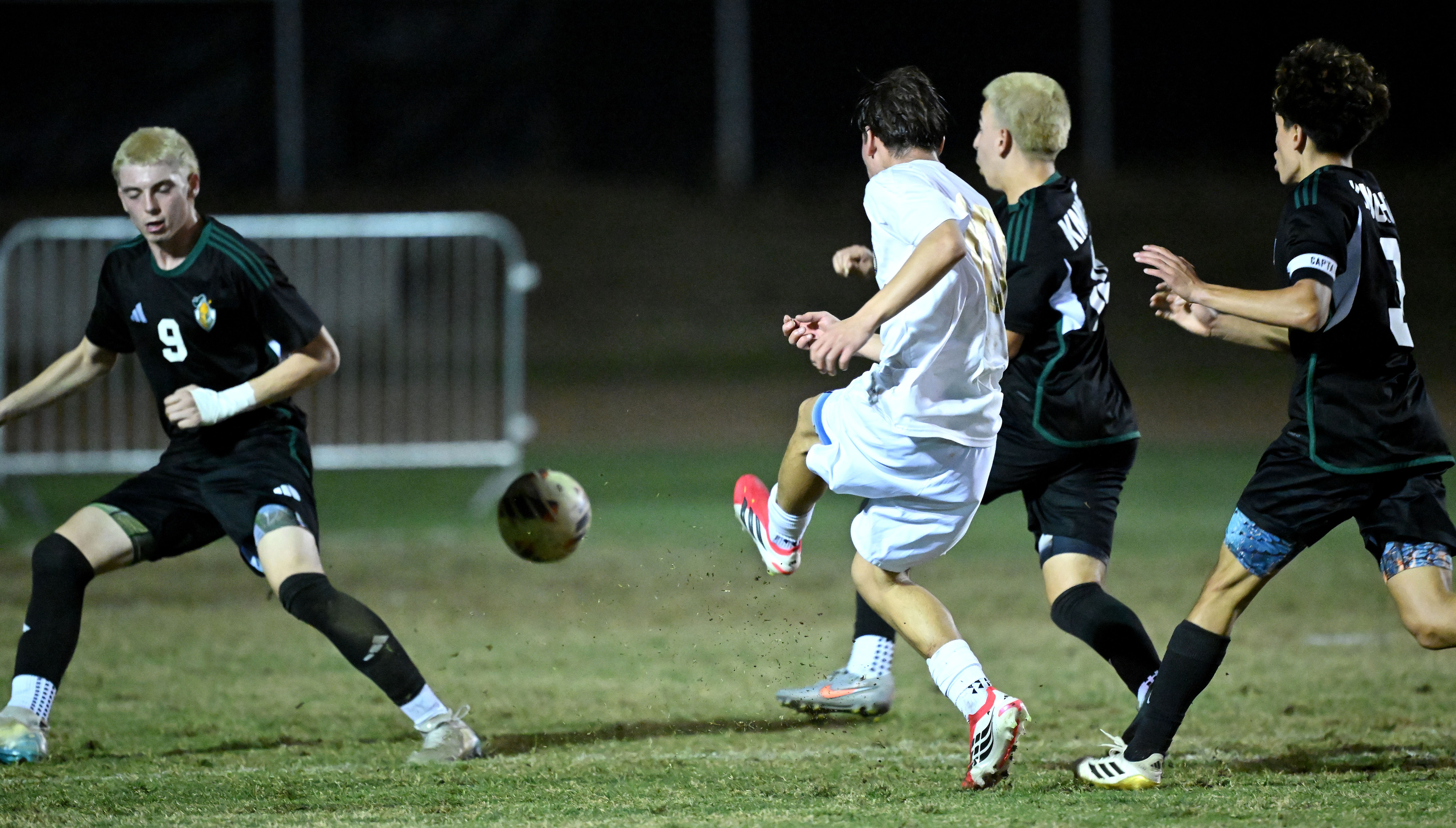 Animo Leadership midfielder Elias Medrano (10) splits Ontario Christian defenders...