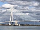 The American side tower of the Gordie Howe International Bridge is shown from downstream along the Detroit River at Windsor's Ojibway Shores natural area on Saturday, Oct. 25, 2025. 