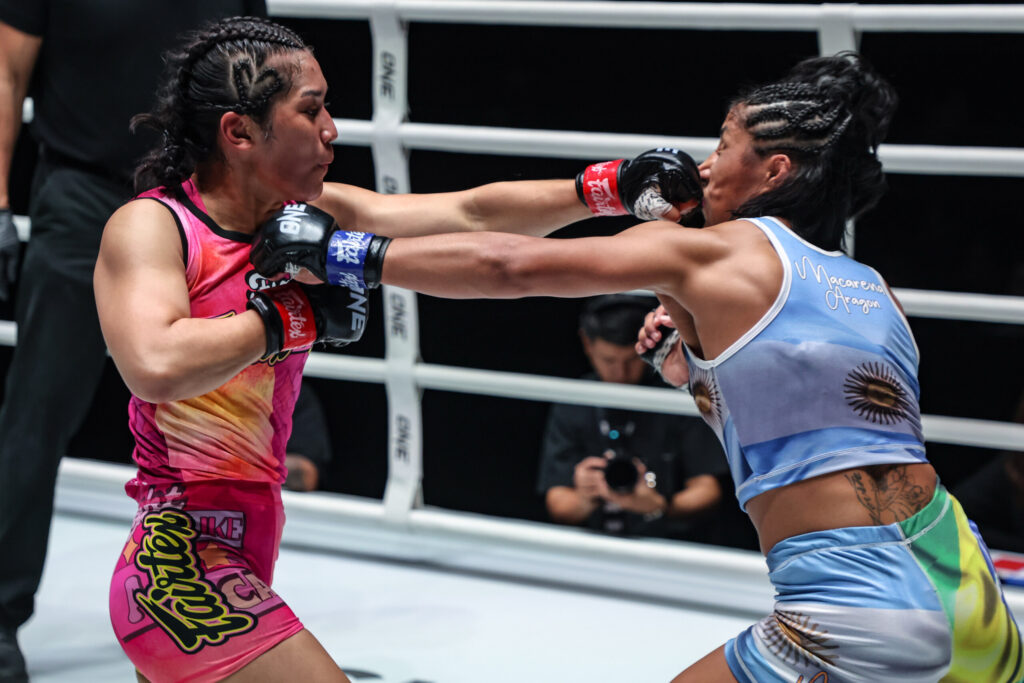 MMA fighter Jihin Radzuan lands a cross on Macarena Aragon