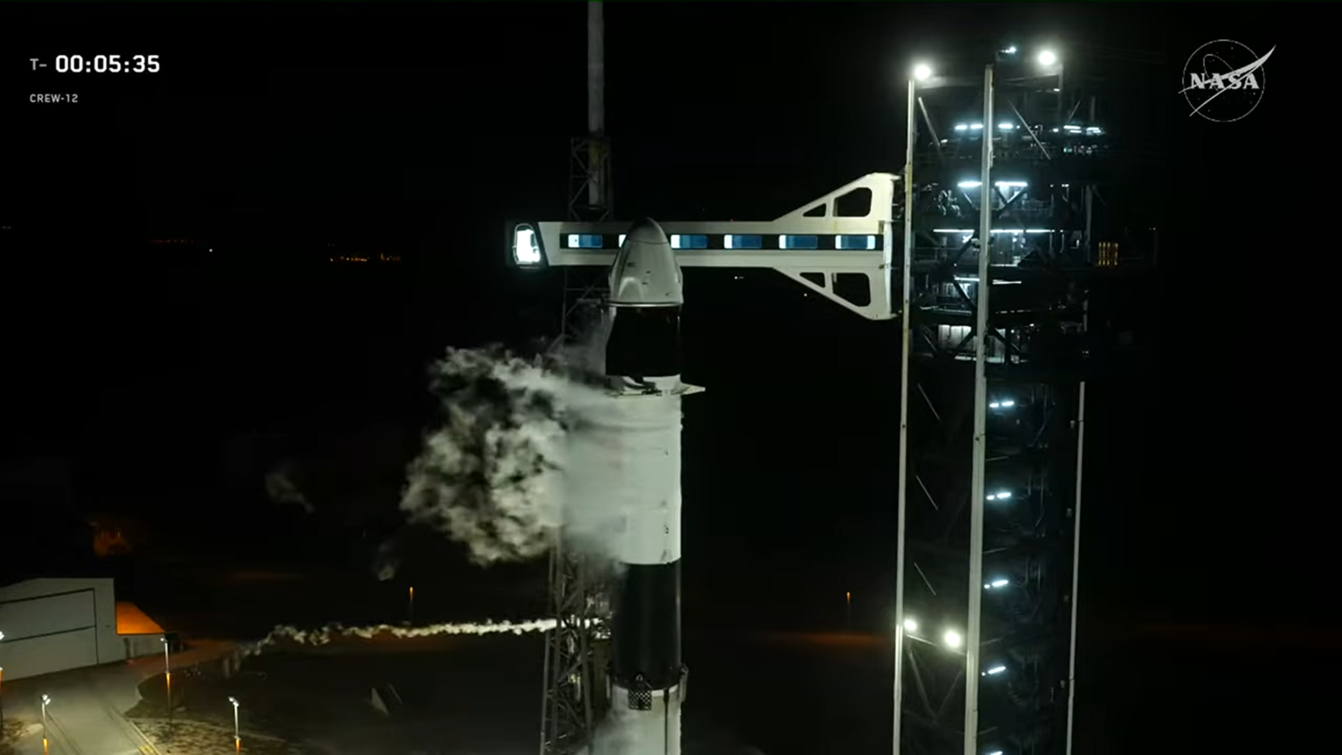 a close view of a SpaceX Falcon 9 rocket and Dragon capsule for launch