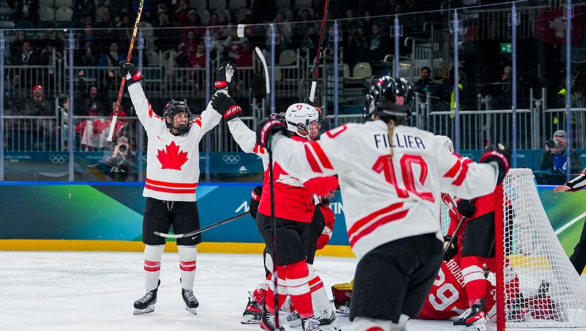 Team Canada's Natalie Spooner celebrates with teammate Marie-Philip Poulin after scoring a goal against Switzerland