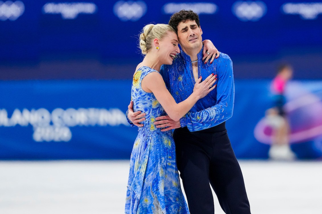 Piper Gilles and Paul Poirier celebrate after competing in the Ice Dance