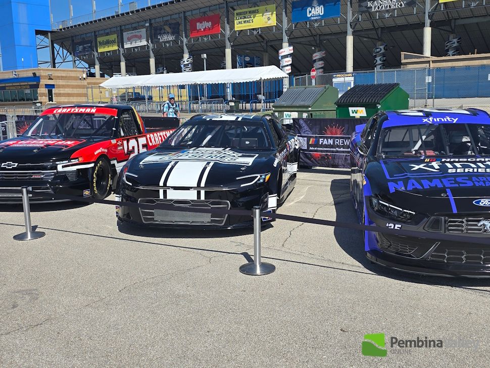 Some of the cars at trucks at the Kansas Speedway