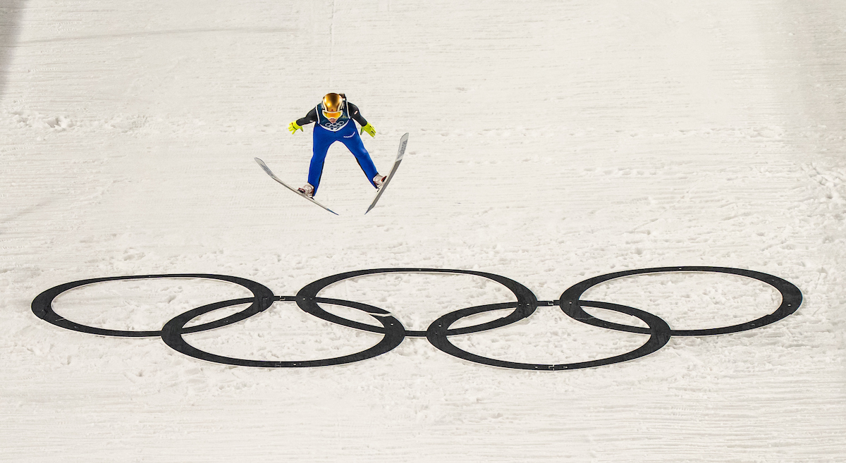 Nicole Maurer soares through the air in women’s normal hill ski jumping.