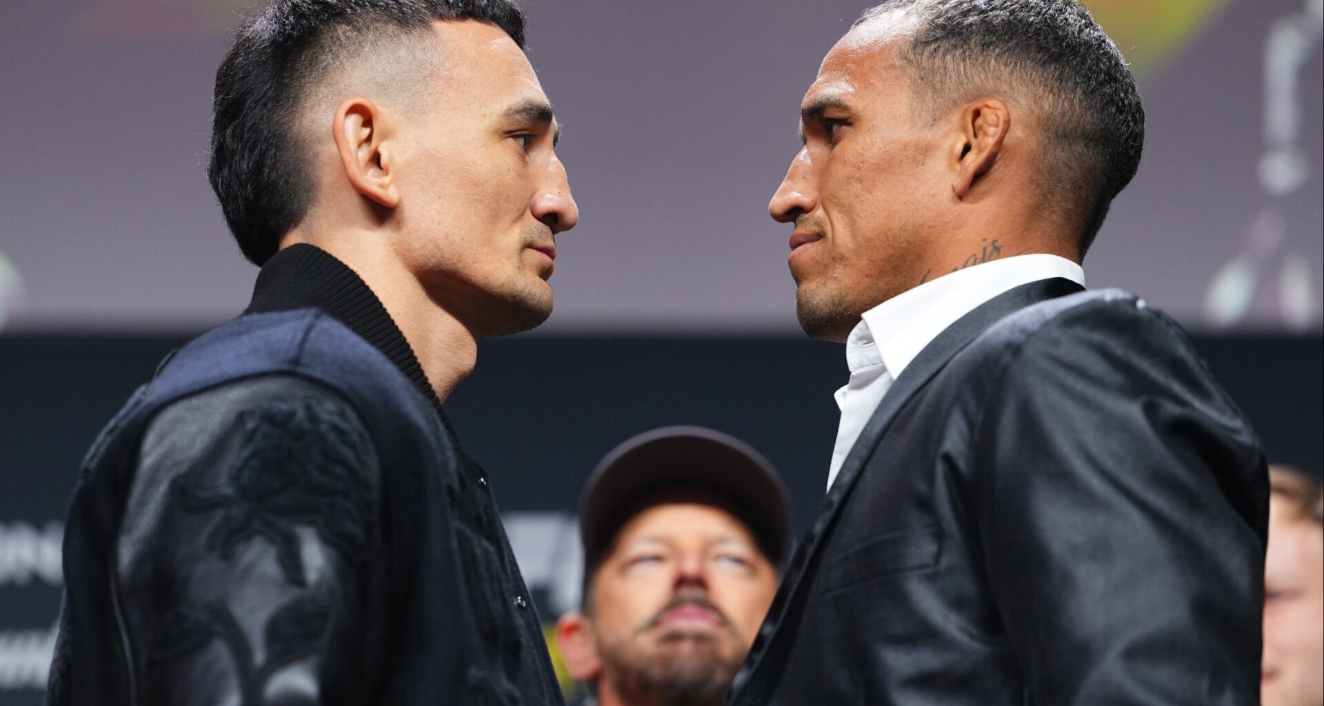 Max Holloway and Charles Oliveira face off at a press conference