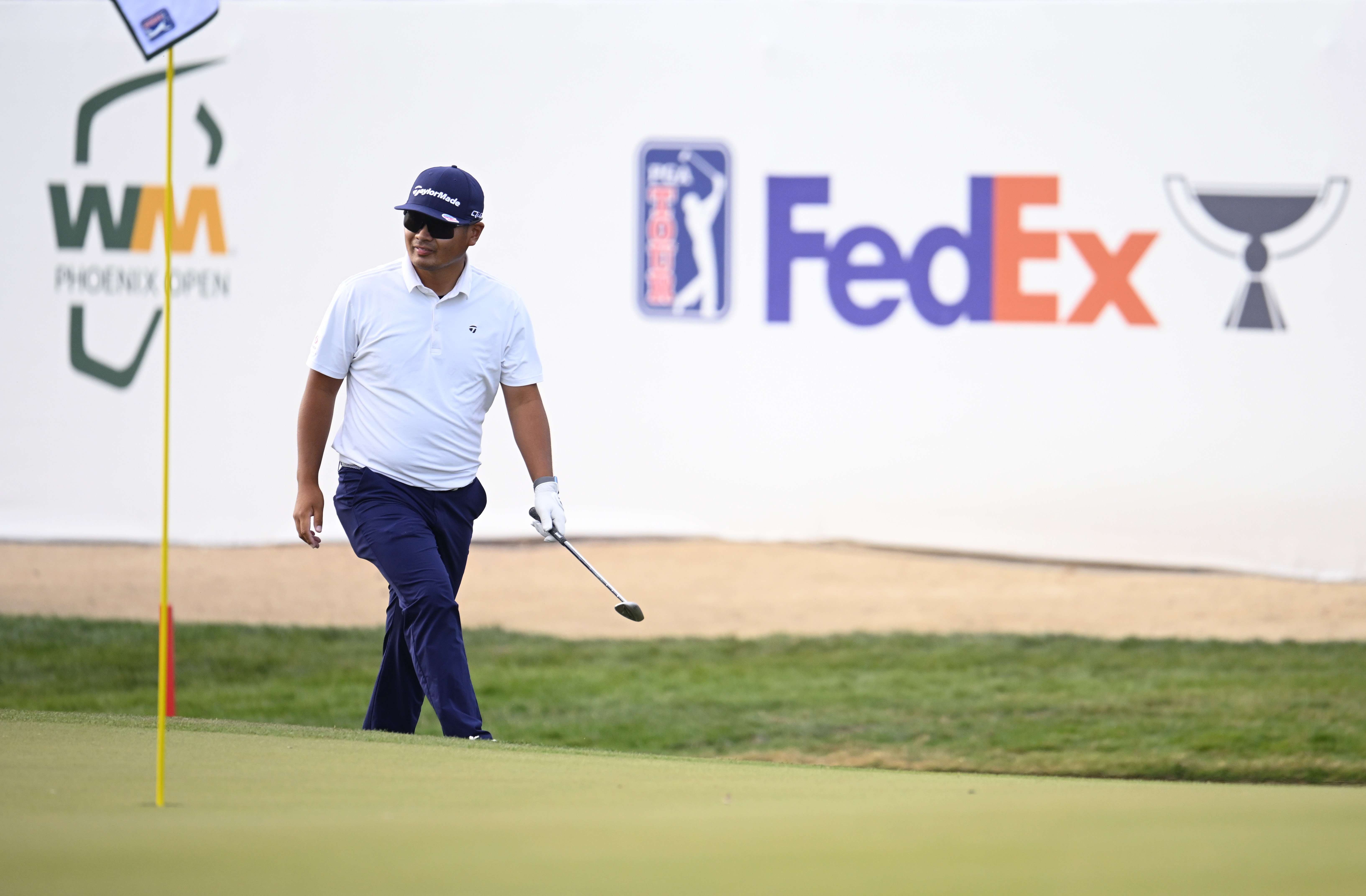 Ryo Hisatsune walks off the green