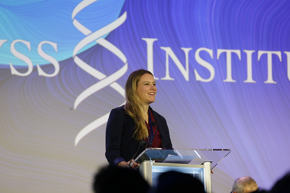 Weckman speaking at a podium