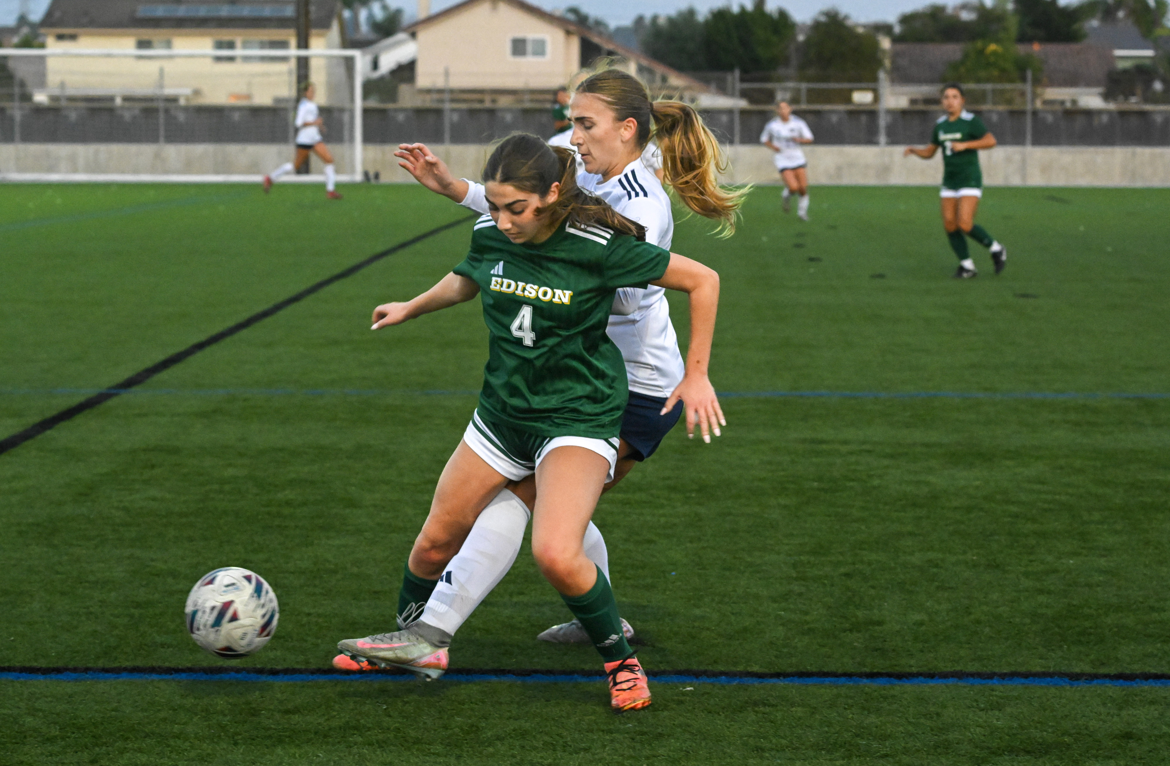 Edisonâs Audrey Scrimgeour (4) and Newport Harborâs Leah Showalter (13)...