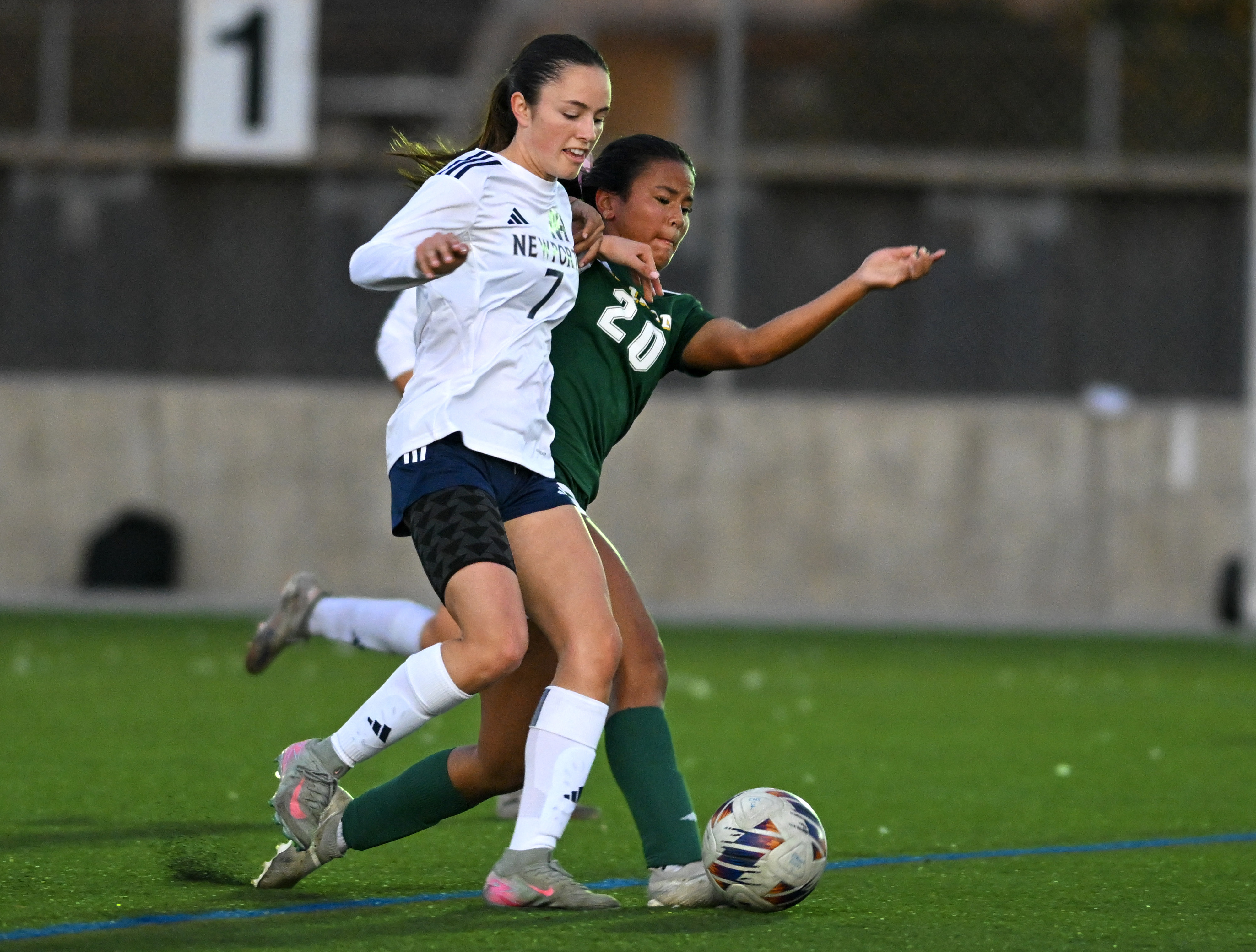 Edisonâs Katelyn Chantha (20) and Newport Harborâs Caroline Harner (7)...