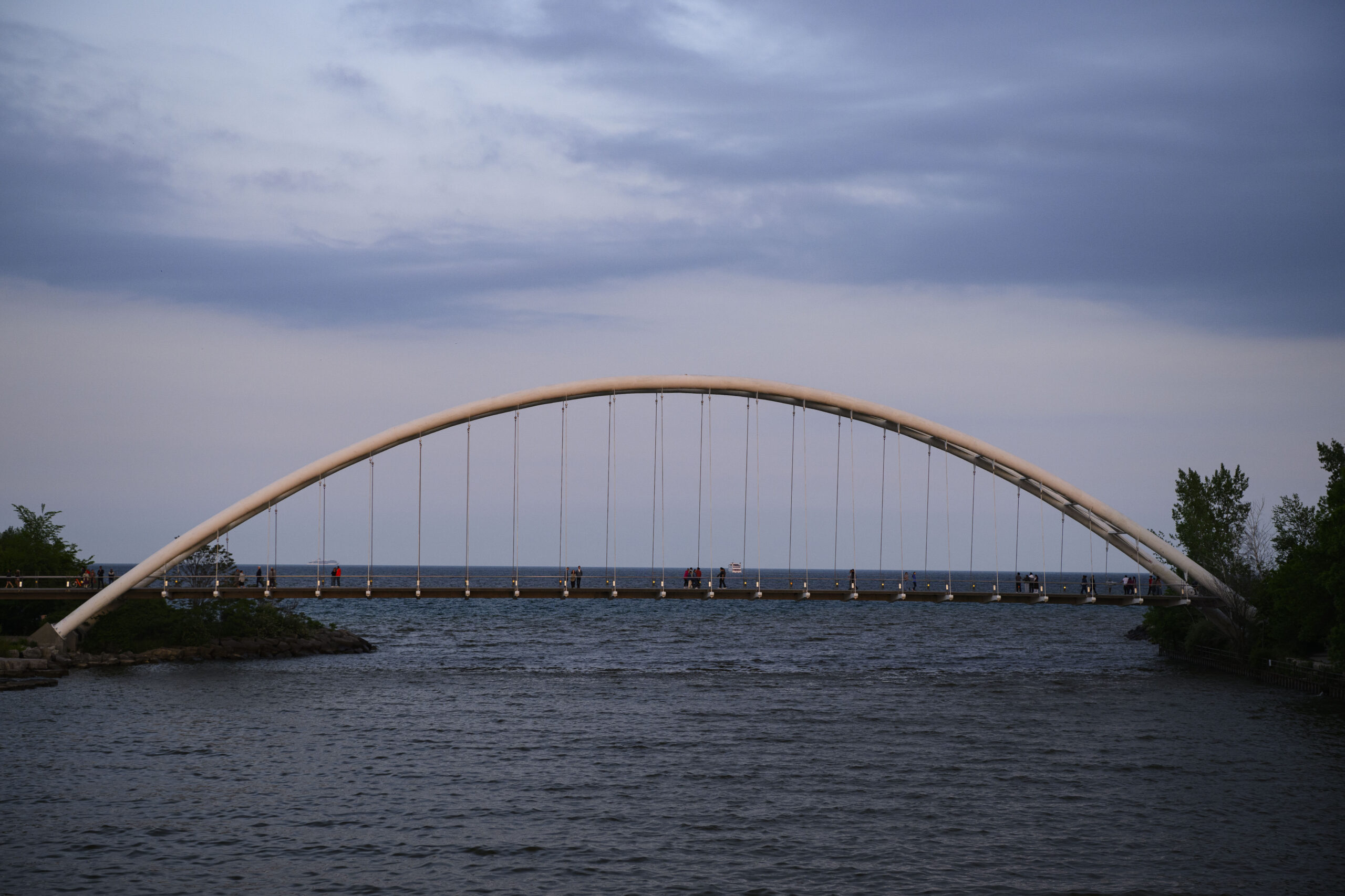 A bridge over the Humber River as it opens onto Lake Ontario