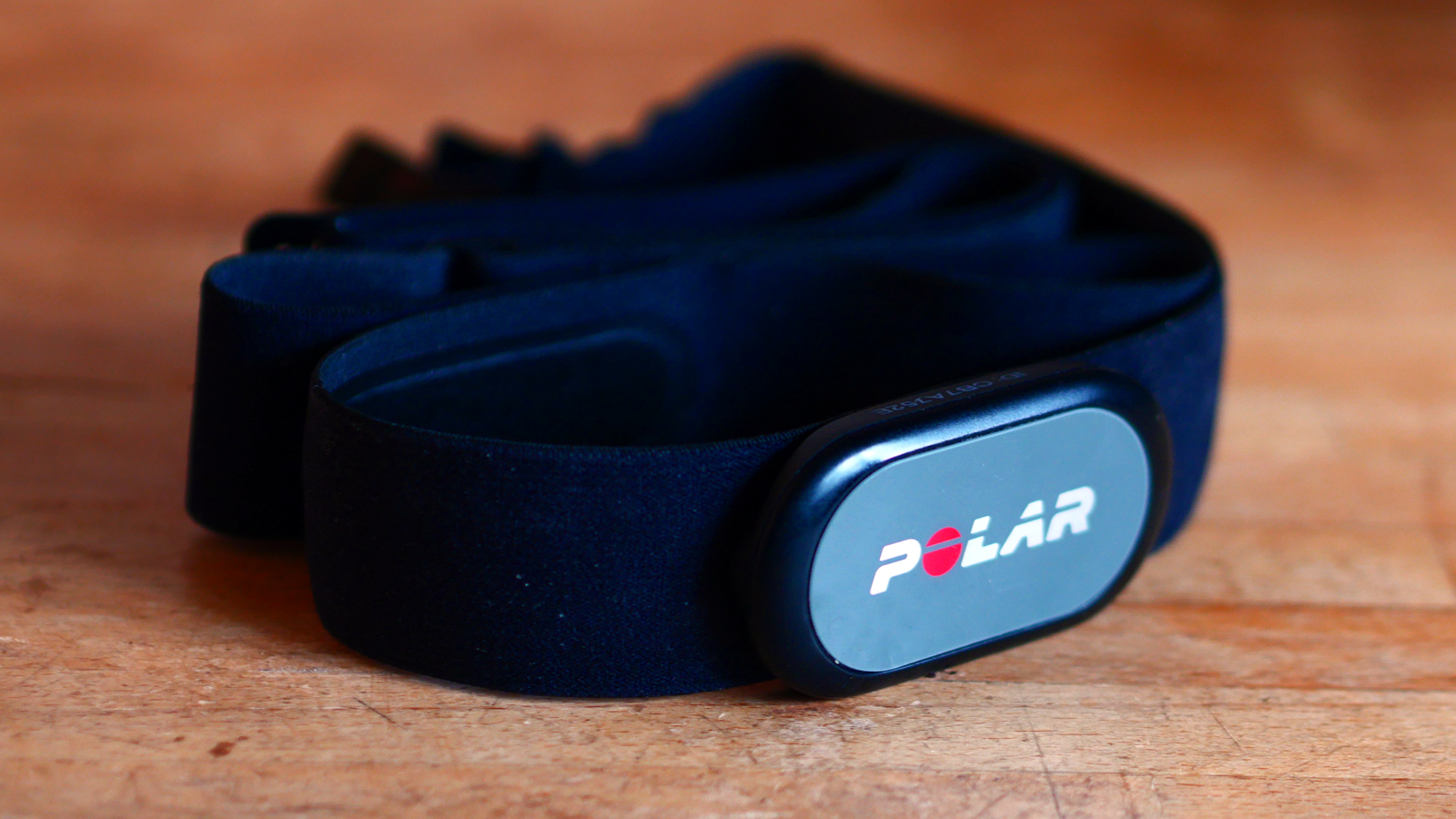 Polar H9 heart rate monitor on a wooden counter top