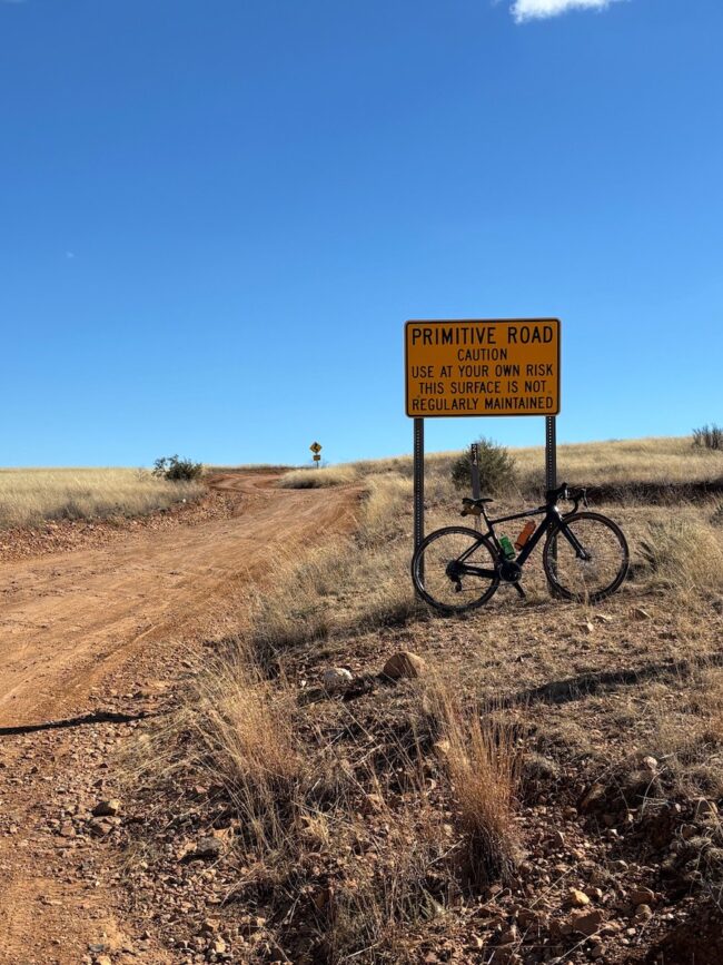 Patagonia road sign with bike on route