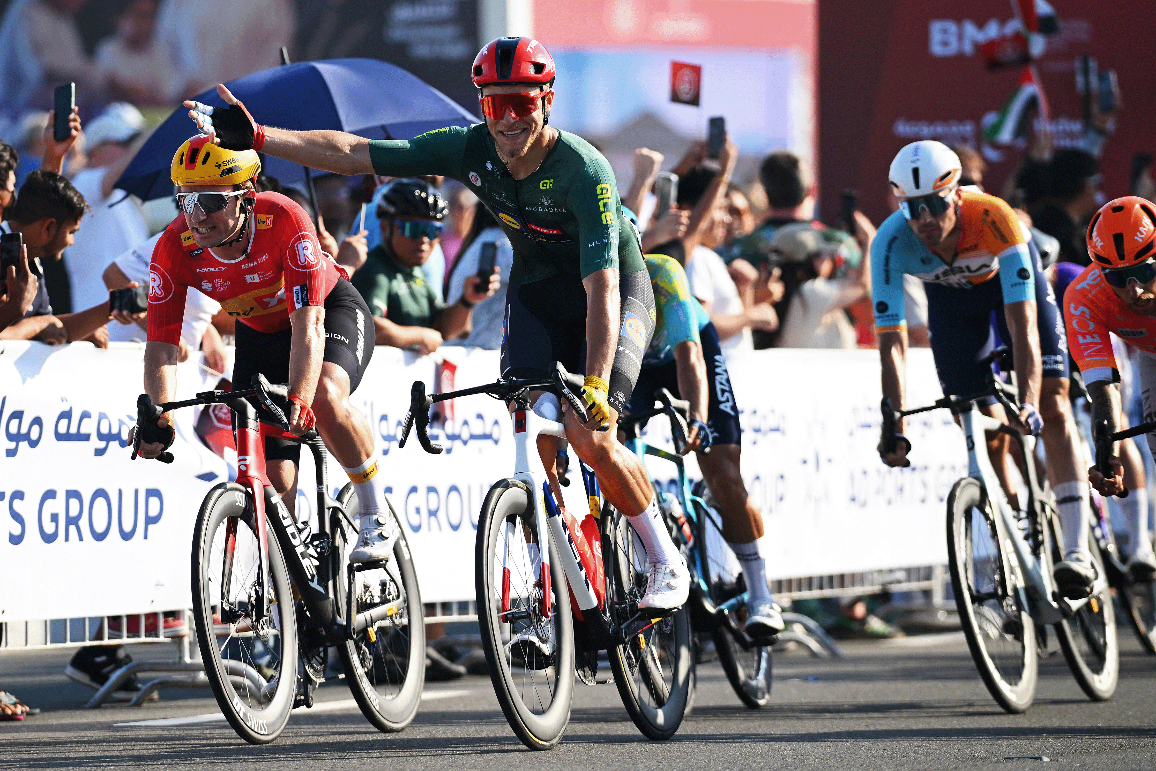 ABU DHABI, UNITED ARAB EMIRATES - FEBRUARY 22: Jonathan Milan of Italy and Team Lidl - Trek - Green Points Jersey celebrates at finish line as stage winner (R) ahead of Erlend Blikra of Norway and Team Uno-X Mobility (L) during the 8th UAE Tour 2026, Stage 7 a 149km stage from Zayed National Museum to Abu Dhabi Breakwater / #UCIWT / on February 22, 2026 in Abu Dhabi, United Arab Emirates. (Photo by Tim de Waele/Getty Images)