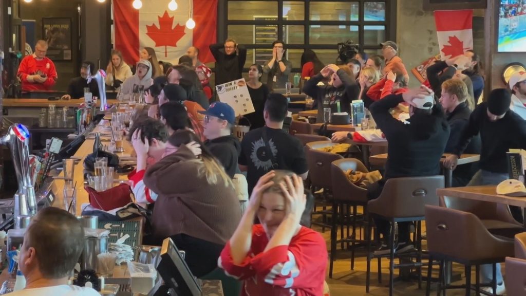 Vancouver hockey fans heartbroken at watch party downtown at the Shark Club after loss against Team USA