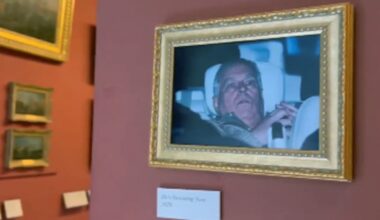 Photo of former Prince Andrew leaving police station hung in the Louvre by activists - CTV News