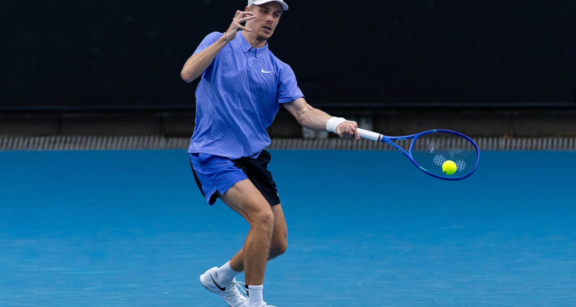 Denis Shapovalov hits a forehand against Bu Yunchaokete at the 2026 Australian Open.