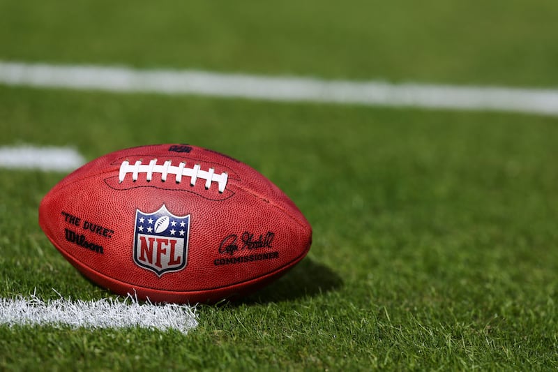 A detail of the NFL Shield logo on a game ball at GEHA Field at Arrowhead Stadium.