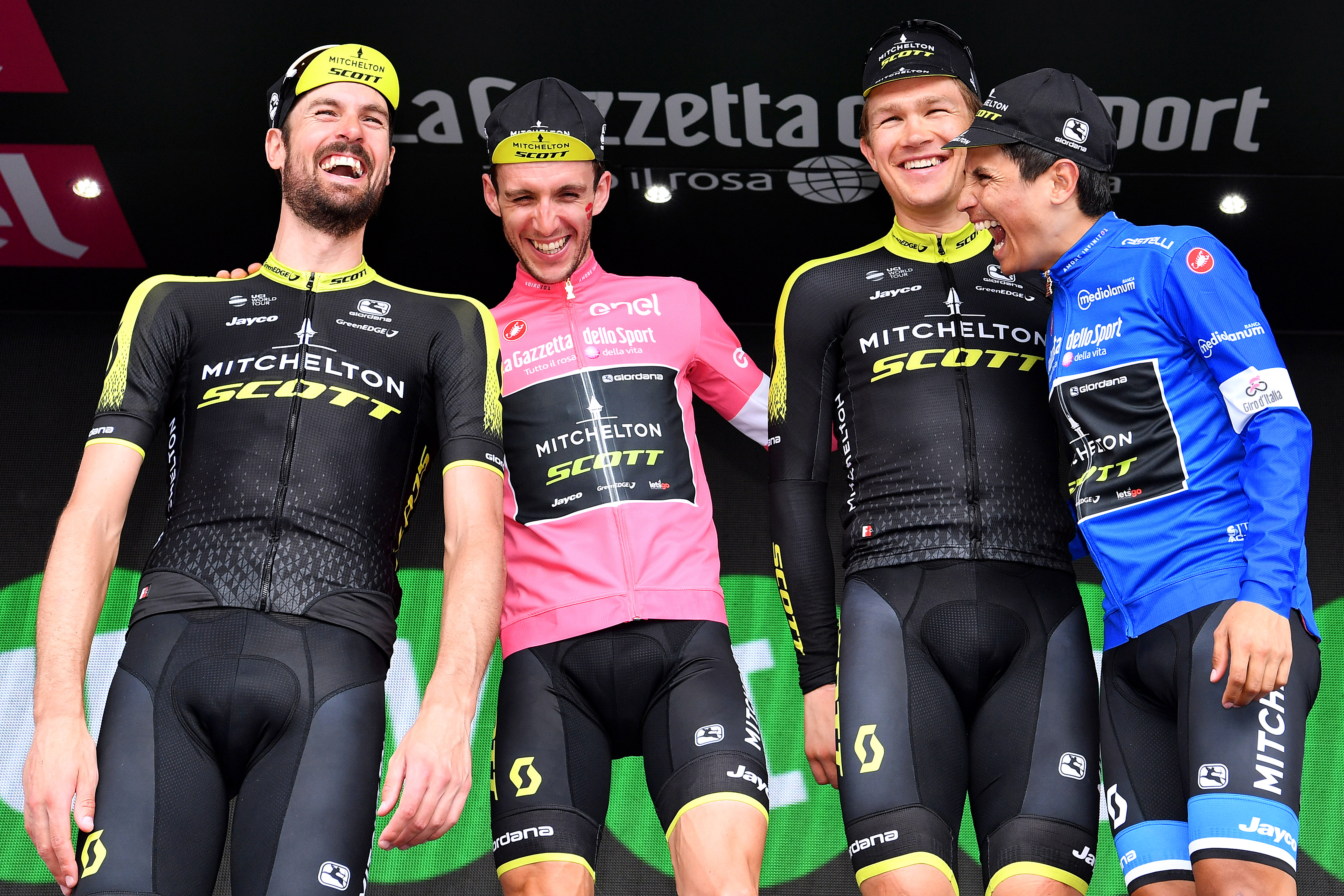 PRAIA A MARE, ITALY - MAY 11: Podium / Sam Bewley of New Zealand and Team Mitchelton-Scott / Simon Yates of Great Britain Pink Leader Jersey / Christopher Juul Jensen of Denmark / Johan Esteban Chaves Rubio of Colombia Blue Mountain Jersey / Team Mitchelton-Scott of Australia / Super Team / Celebration / during the 101th Tour of Italy 2018, Stage 7a 159km stage from Pizzo to Praia a Mare / Giro d&amp;apos;Italia / on May 11, 2018 in Praia a Mare, Italy. (Photo by Justin Setterfield/Getty Images)