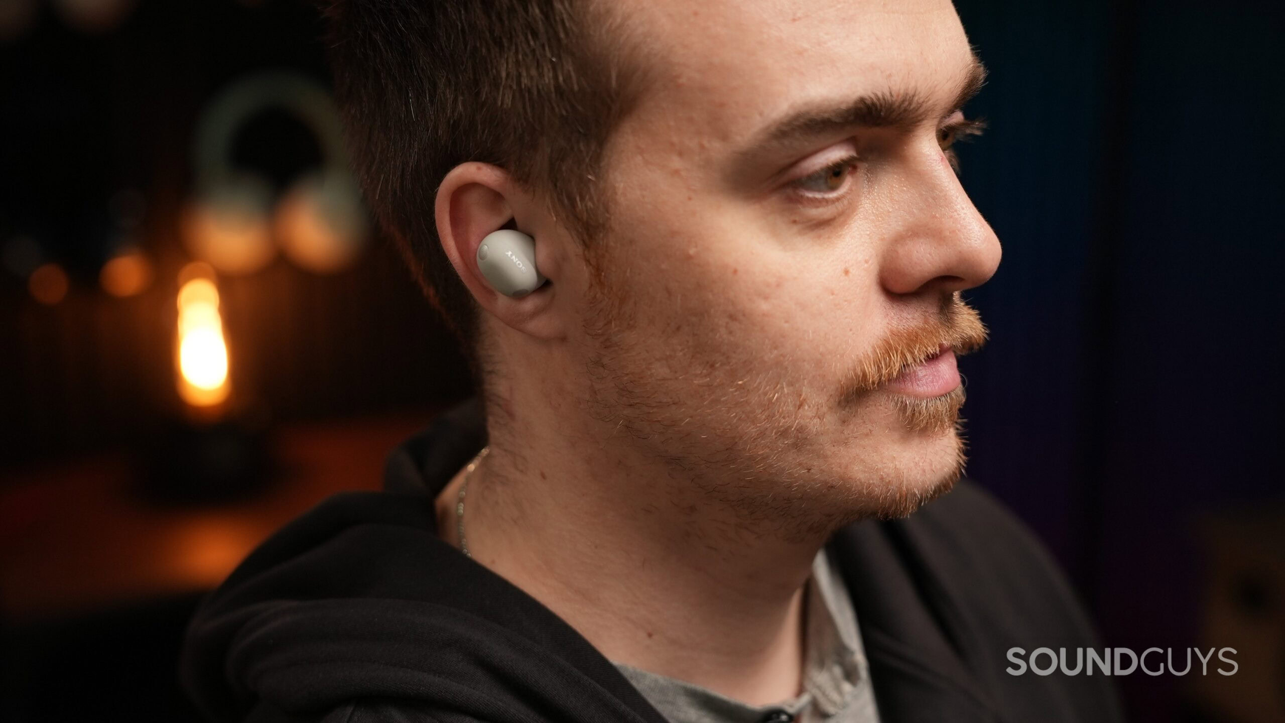 a man listening to the sony wf-1000xm6 earbuds a man listening to the sony wf-1000xm6 earbuds