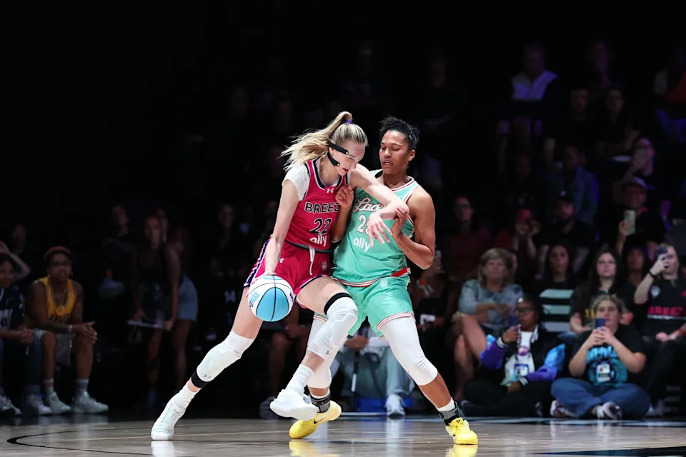 Cameron Brink of the Breeze collides with Alyssa Thomas of the Laces.